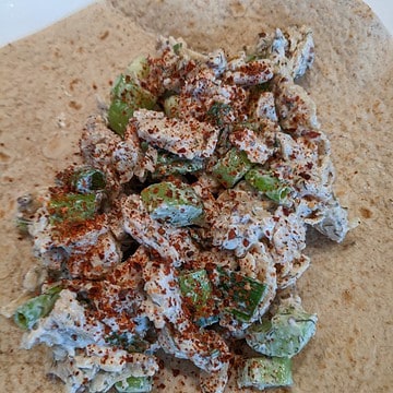 A closeup picture of Soycurl salad on a tortilla.