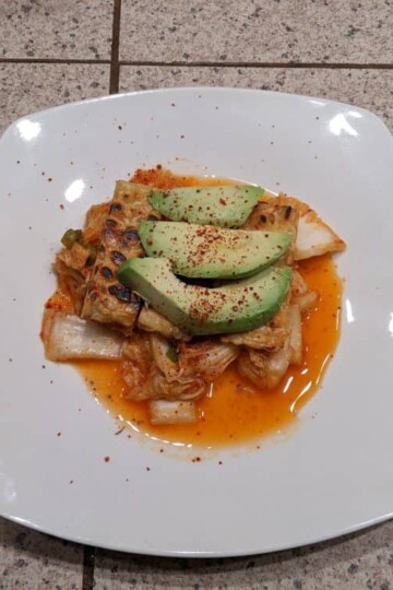 Kimchi with pan-seared tempeh and avocado.