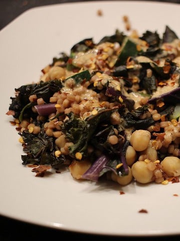 Pearl couscous with zucchini and red kale