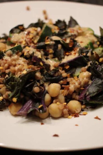 Pearl couscous with zucchini and red kale
