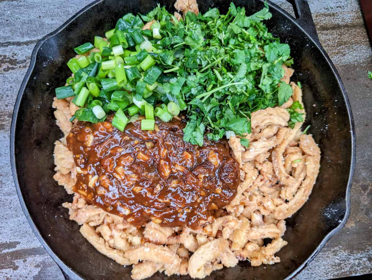 Mongolian soy curls with sauce and greens added.