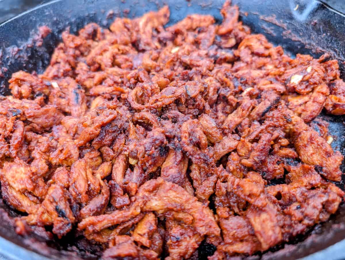 The soy curls coated with BBQ sauce after browned.