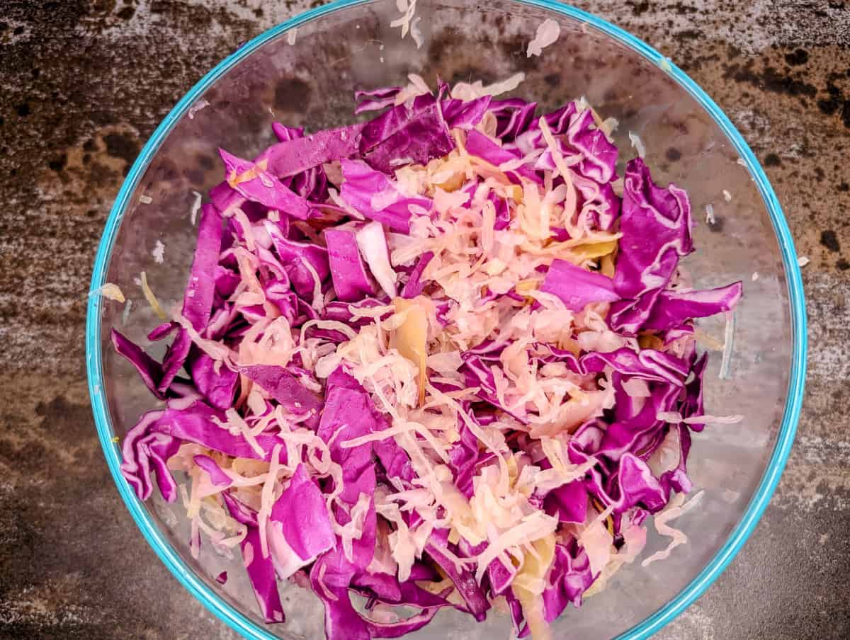 Cabbage and sauerkraut slaw., mix sauerkraut and cabbage.