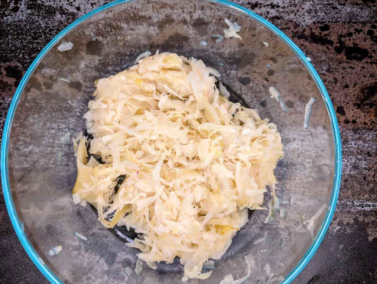 Cabbage and sauerkraut slaw., sauerkraut in bowl.