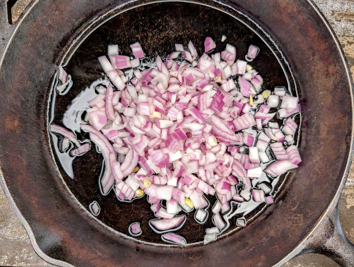 Sloppy Jacks, in pan, add onions.