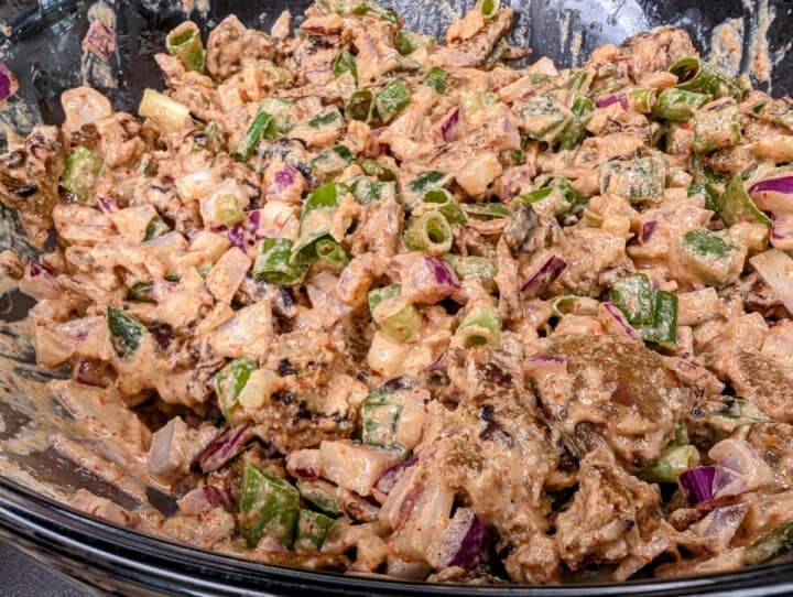 Seitan tahini salad, with onions and jalapeños.