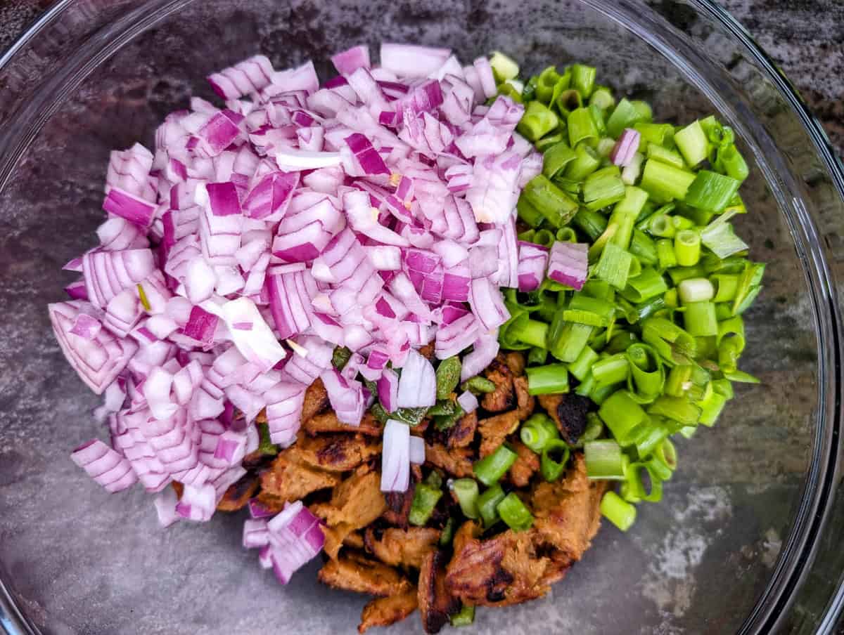 Add the onions to the bowl.