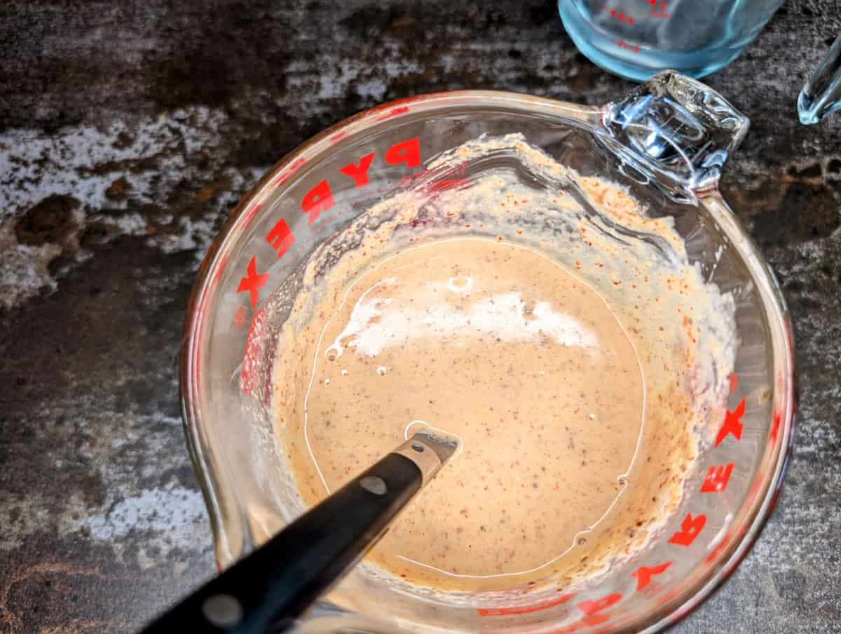 Mix the tahini sauce with the water until smooth.