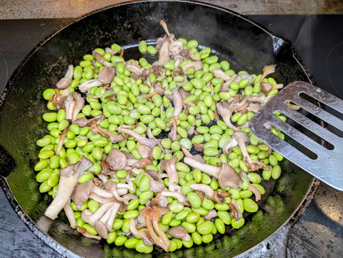 Bibimbap, step 18, add edamame to the mushrooms and cook until hot, perhaps a bit seared