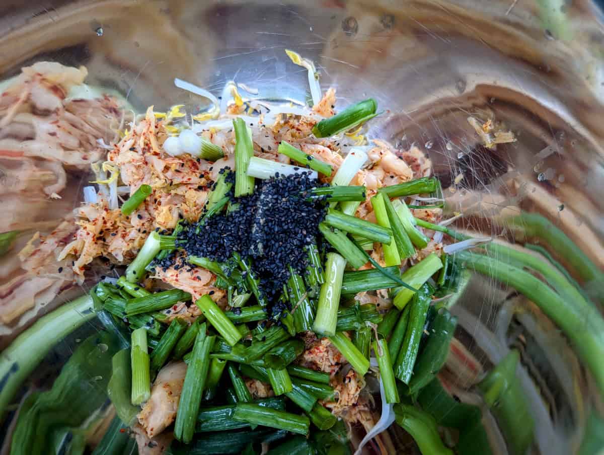 Mung Bean Pancakes, Step 9, Add the black sesame seeds and sesame oil to the bowl.