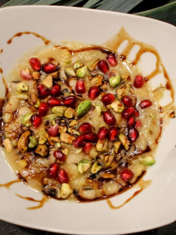 Black-eyed pea, yellow split pea, leek soup, topped with pomegranate seeds, pistachios, and pomegranate molasses.