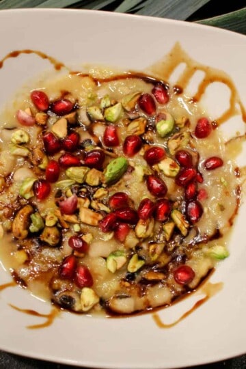 Black-eyed pea, yellow split pea, leek soup, topped with pomegranate seeds, pistachios, and pomegranate molasses.