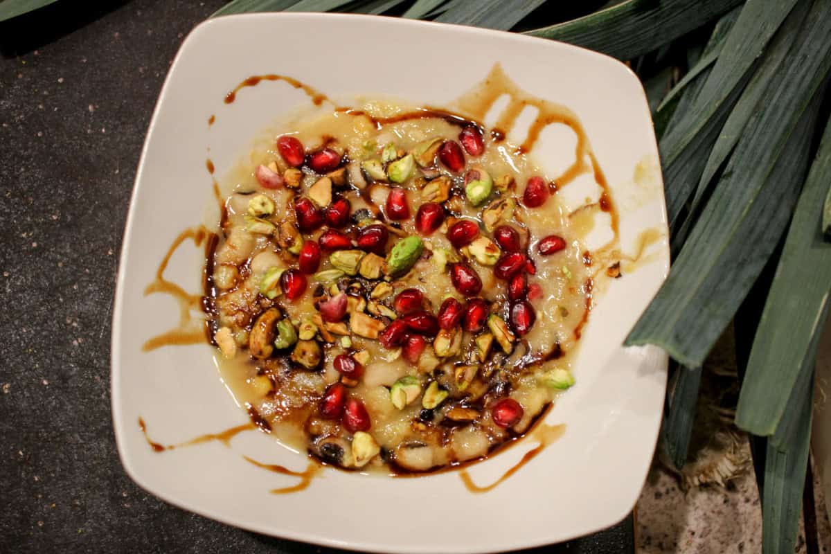 Black-eyed pea, yellow split pea, leek soup, topped with pomegranate seeds, pistachios, and pomegranate molasses.