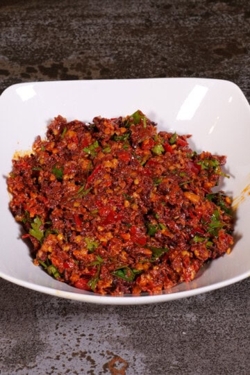 Calabrian pepper tapenade in a white bowl