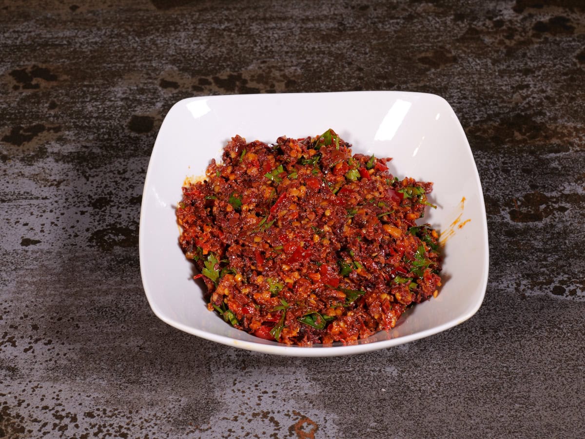 Calabrian pepper tapenade in a white bowl