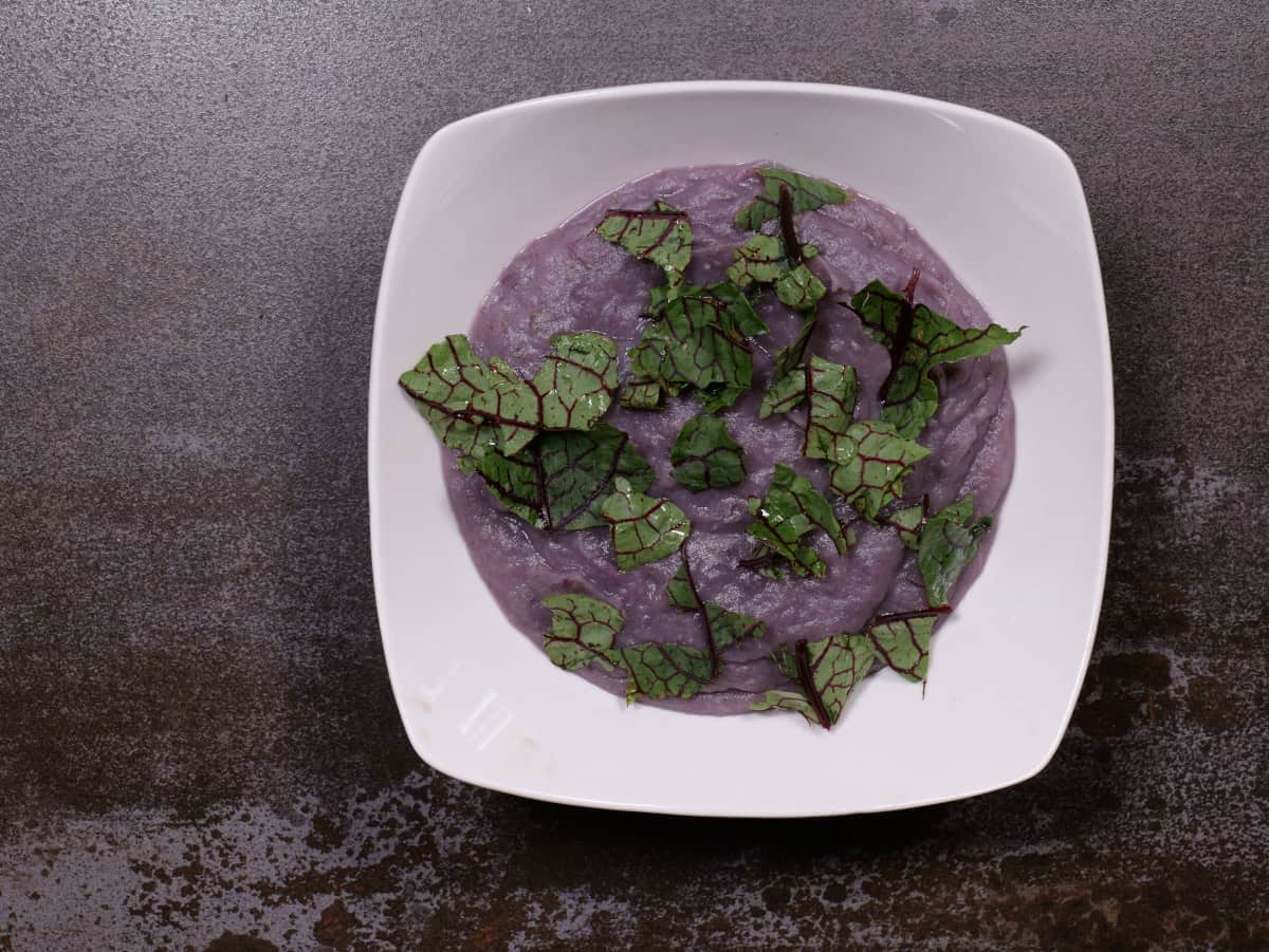 Potato, leek, sorrel soup topped with sorrel leaves