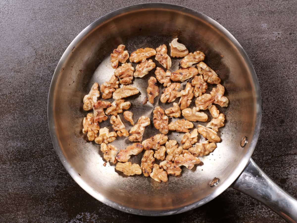 toasted walnuts in pan