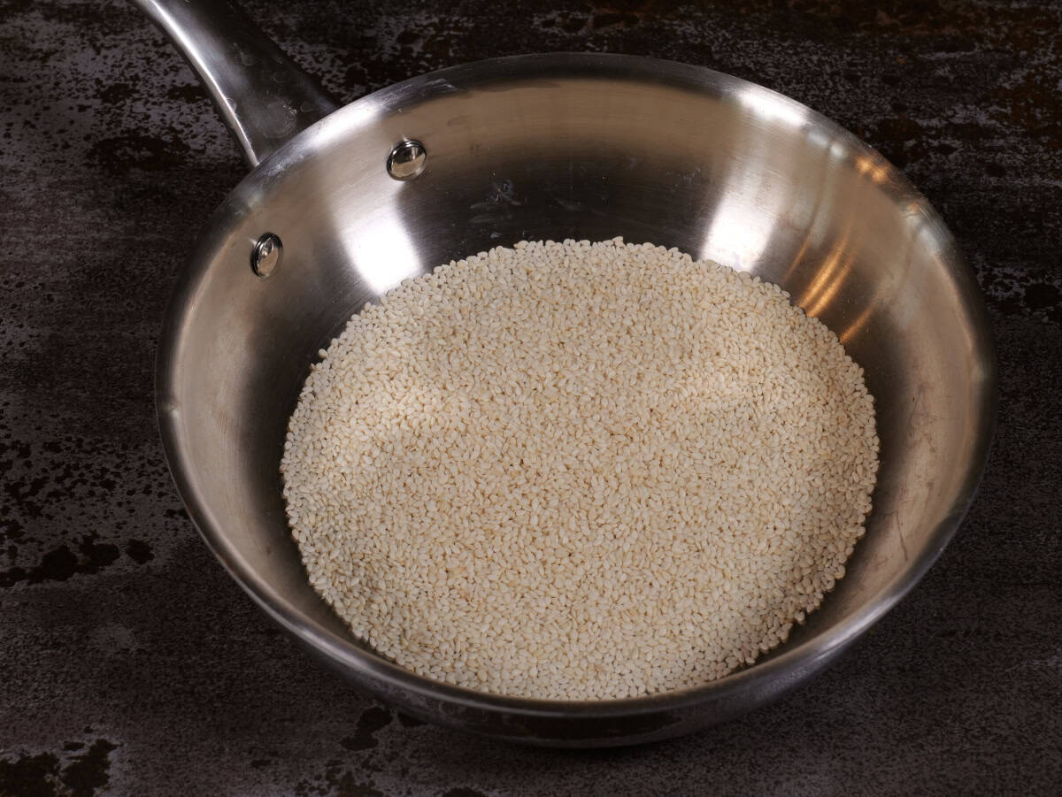 Step 5, za'atar seasoning mix. Place sesame seeds into a pan. Toast over low heat, until a few shades darker.