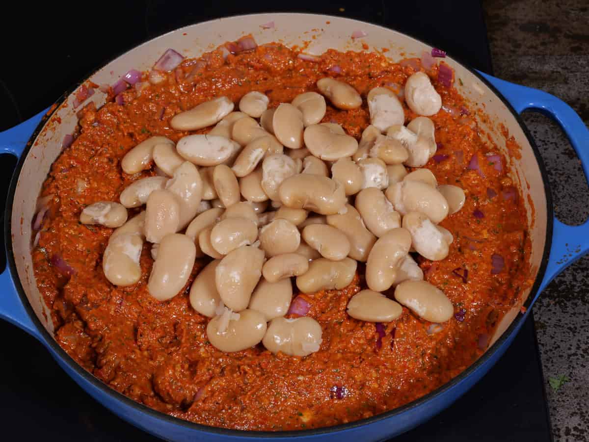 beans on top of sauce and onions