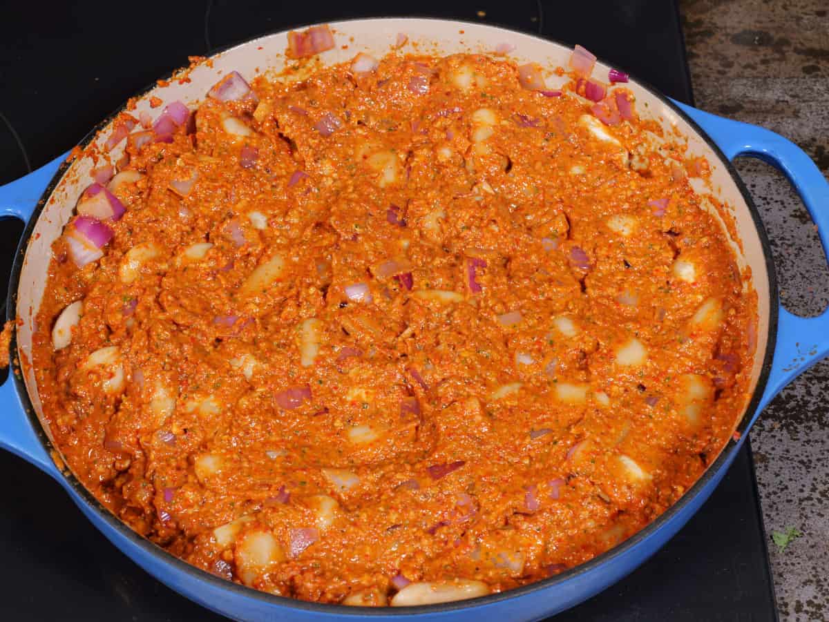 beans and onions mixed with the sauce