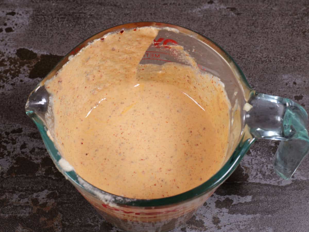 Tahini/lemon/garlic sauce mixed well in the measuring cup.