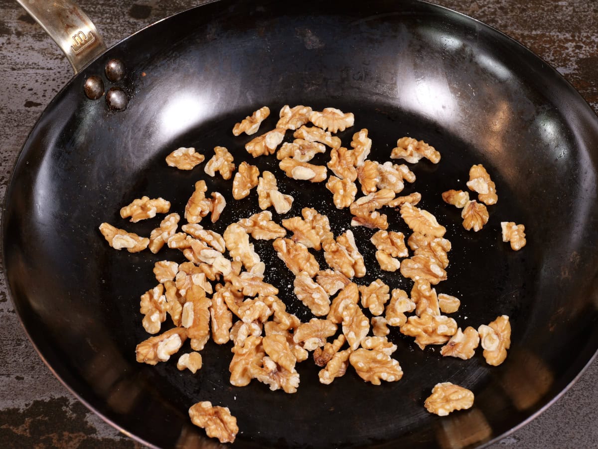 un-toasted walnuts in pan