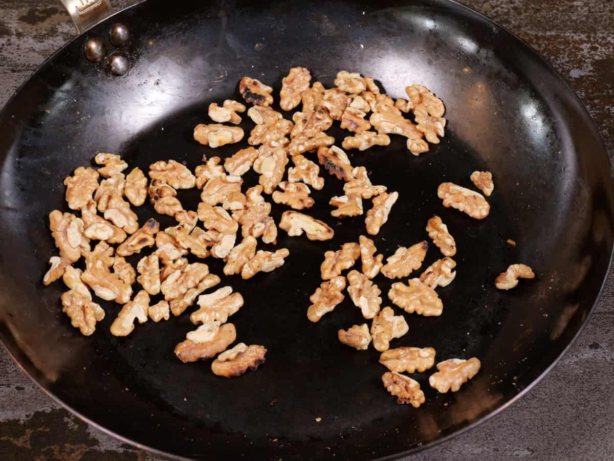toasted walnuts in pan