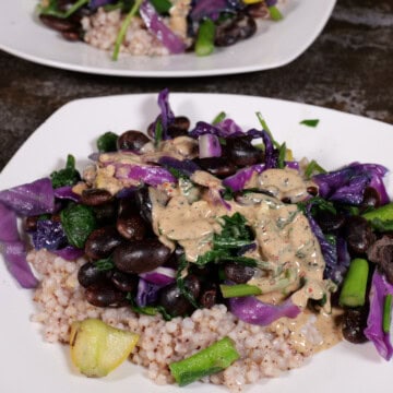 Tahini/lemon/garlic sauce over beans, cabbage, and sorghum.