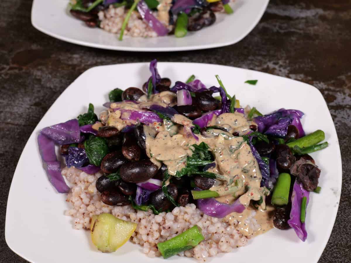 Tahini/lemon/garlic sauce over beans, cabbage, and sorghum.