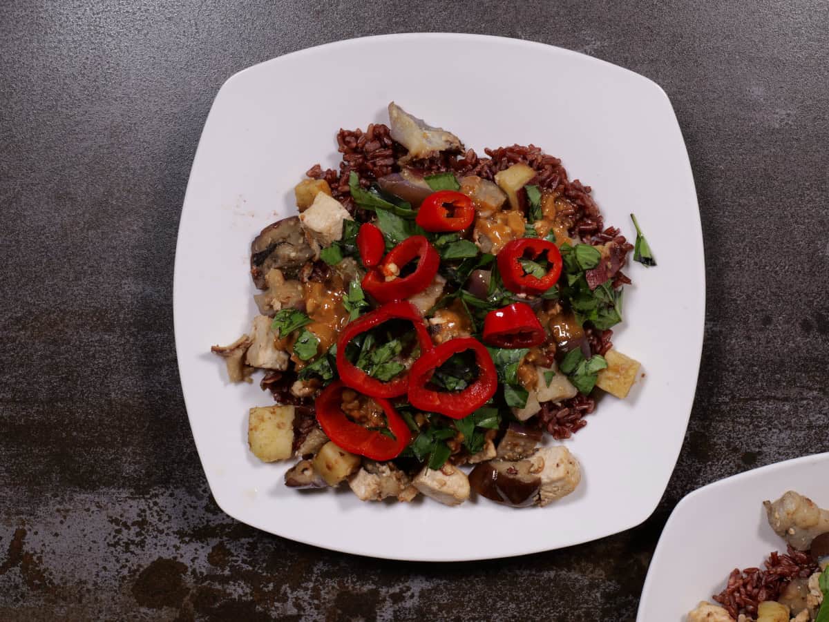 a tofu, sweet potato, eggplant scramble with peanut sauce, Thai basil and Fresno chilis