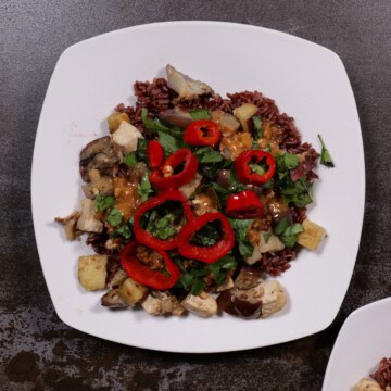 a tofu, sweet potato, eggplant scramble with peanut sauce, Thai basil and Fresno chilis