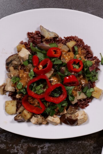 a tofu, sweet potato, eggplant scramble with peanut sauce, Thai basil and Fresno chilis