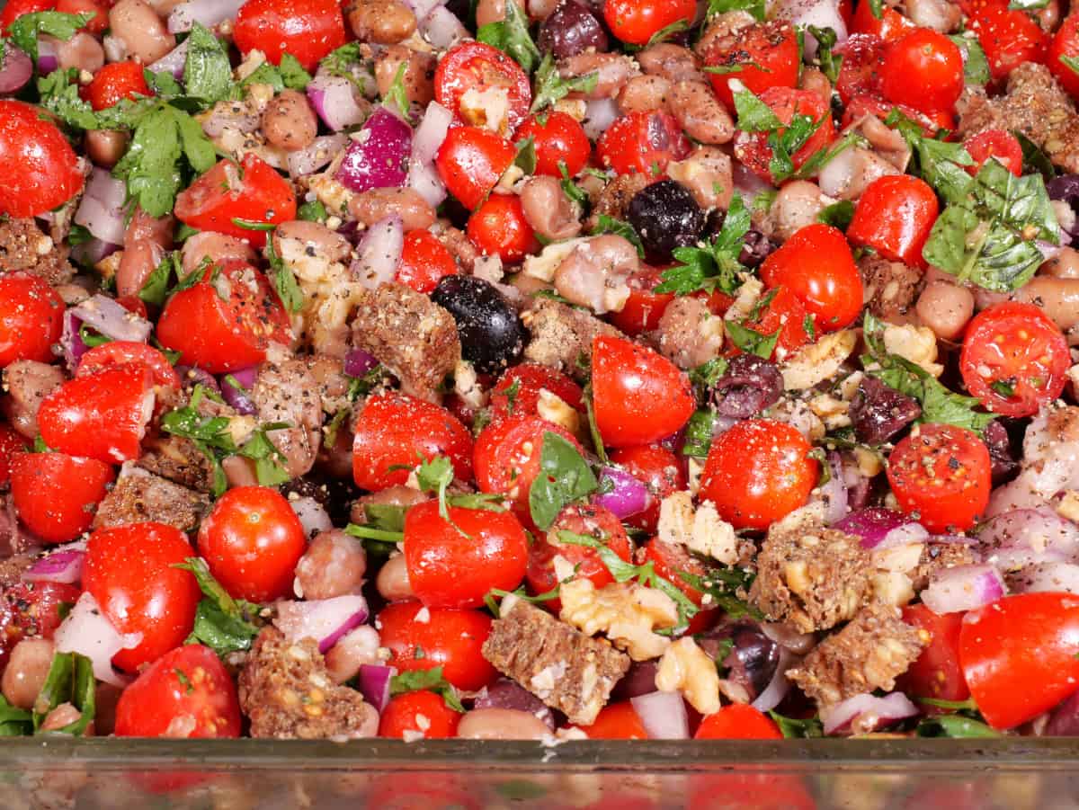 raw bean, bread, and tomato casserole up close in the pan