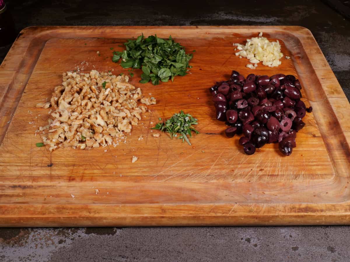 The walnuts, basil, rosemary, olves, and garlic chopped