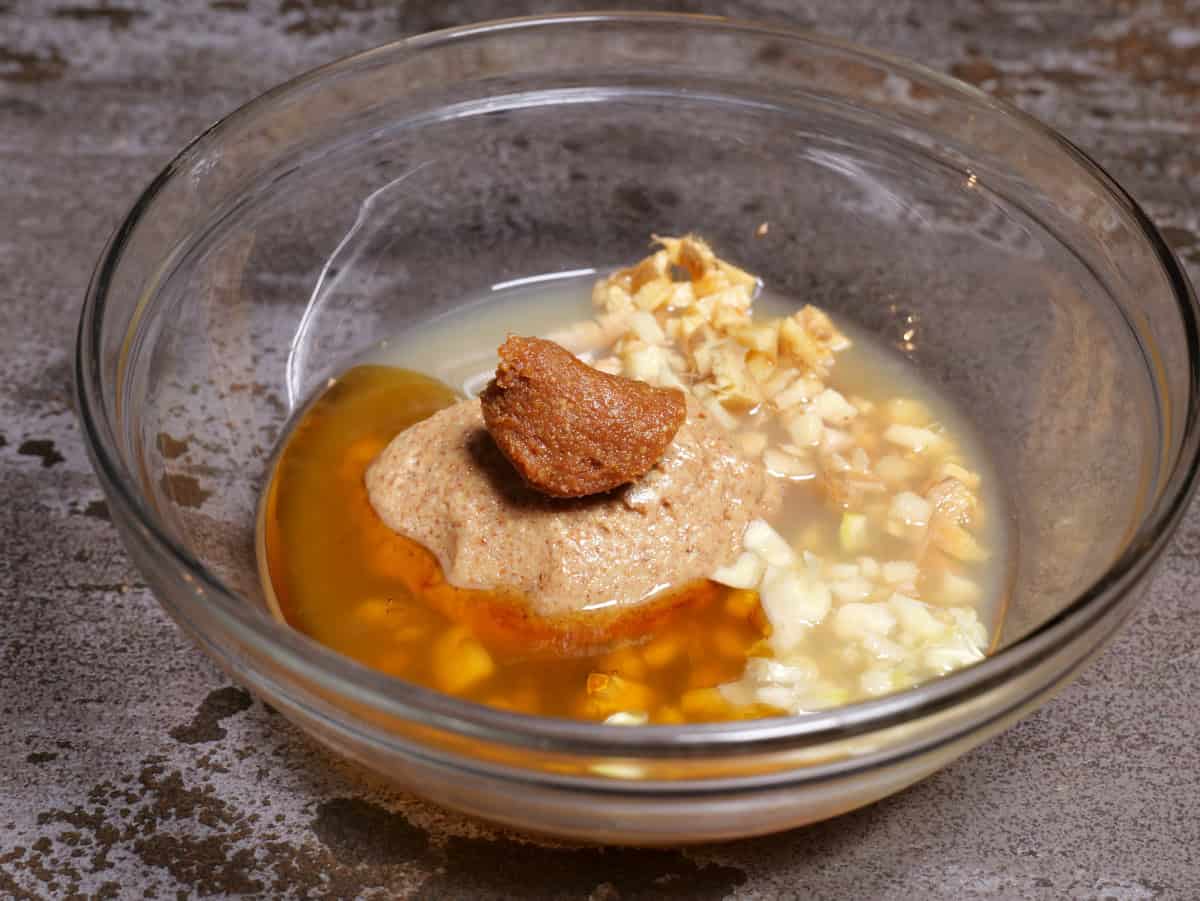 All of the dressing ingredients in a bowl.