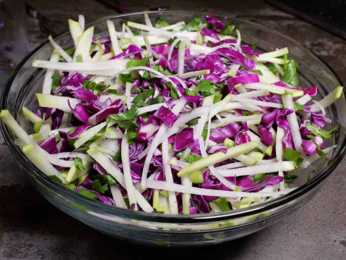 The vegetables for the asian salad mixed together without the dressing